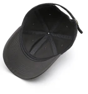 Detail view of cotton baseball cap interior showing reinforced seams and metal buckle