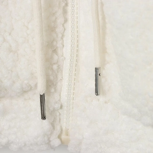 White fleece jacket with high collar featuring a sturdy resin zipper and metallic drawstrings