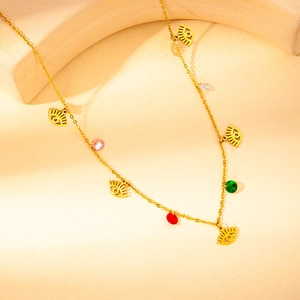 Detailed view of gold stainless steel necklace with evil eye and multicolor zircon charms