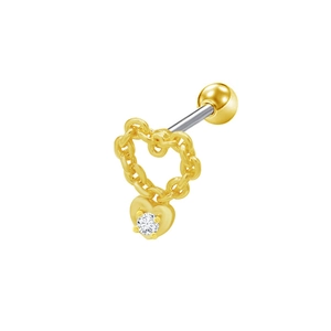Dettaglio macro del piercing in acciaio inossidabile dorato a forma di cuore con zircone