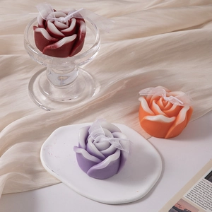 Handcrafted rose scented candle set in burgundy, orange and purple with ribbon decor