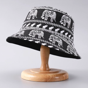 Exotic black fisherman bucket hat with white elephant and palm tree prints for women and men