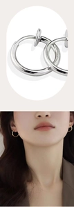 Detail view of non-piercing silver and gold spring clip-on earrings for men and women