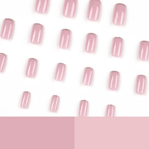 Pink square press-on nails with silver glitter tips displayed on a clean white background