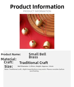 Detail showing small brass bell with red string, dimensions 2.85cm diameter and 2.6cm height