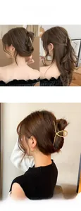 Close-up of golden alloy butterfly claw clip and twisted metal hair accessories