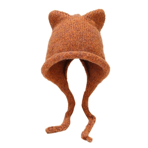Winter orange knit hat with cat ears and braided ear flaps for outdoor warmth