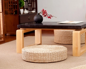 Close-up of a handmade round straw tatami cushion with detailed natural fiber weaving