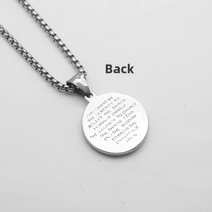 Detail showing the engraved Serenity Prayer on the back of the vintage round pendant