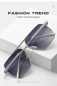 Close-up of geometric silver metal frame polarized sunglasses on a white pedestal