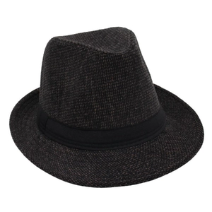 Macro detail of charcoal wool texture and black grosgrain ribbon on the classic Fedora hat
