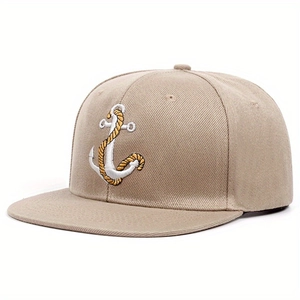 Detailed close-up of the anchor and gold rope embroidery on this khaki snapback cap
