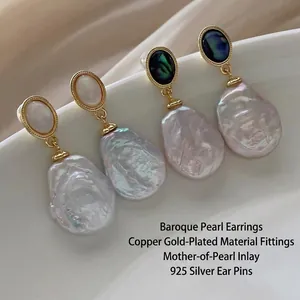 Elegant baroque pearl earrings with shell inlay and 925 silver pins in a gold finish