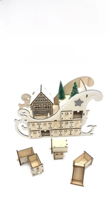 Macro detail of wooden sleigh advent calendar with numbered 24-day countdown drawers