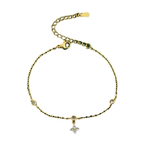 Elegant gold bracelet with clover pendant and zircon accents, featuring adjustable lobster clasp