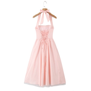 Detail of pink halter neck dress featuring a back lace-up design and white mesh lining