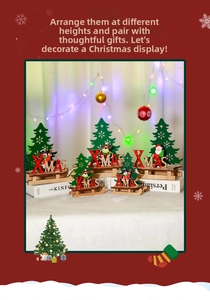 Close-up of five DIY painted wooden Christmas sleigh ornaments with Xmas and tree motifs