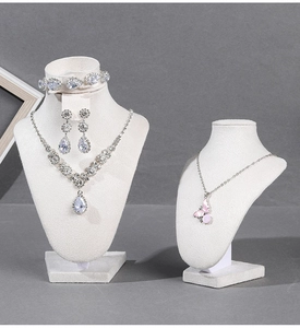 Detailed display of silver necklace with pink butterfly pendant and zircon jewelry set
