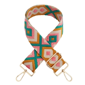 Detail of colorful geometric jacquard 5cm bag strap with gold metal lobster clasps