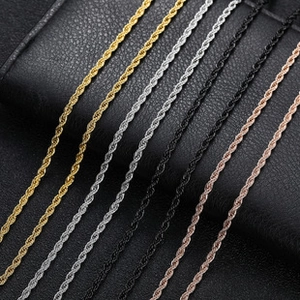 Detailed close-up of rope chain necklaces in gold, silver, black, and rose gold finishes