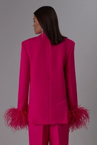 Magenta suit set featuring luxury ostrich feather trim on cuffs and straight-leg trousers