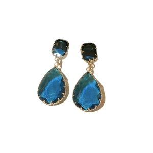 Blue teardrop and square gemstone drop earrings with elegant golden prong settings