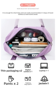 Macro view of purple waterproof travel bag showing large main compartment and inner pocket