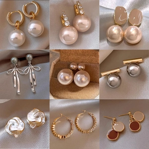 Collection of nine elegant 925 silver needle pearl earrings in various vintage styles