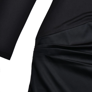 Detail shot of the waist ruching on the slim fit black mock neck long sleeve dress
