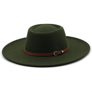 Detail of dark green wool fedora hat featuring a brown leather strap and metal buckle
