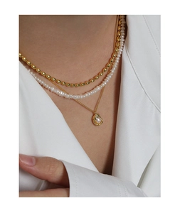 Detailed view of layered S925 silver gold-plated necklace with elegant freshwater pearls