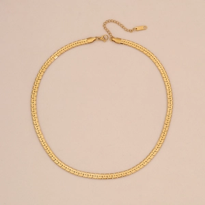 Close-up of 18K gold snake chain necklace with lobster clasp and K18 hallmark tag