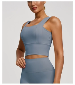 Detail of greyish blue yoga set featuring a square neck sports bra and high waist leggings