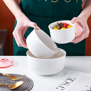 Three-piece set of white ceramic food storage bowls with lids for microwave use