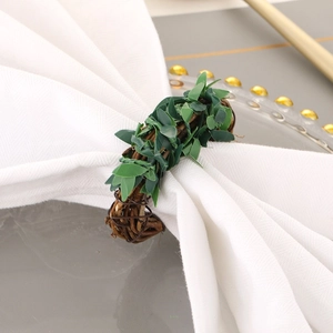 Green leaf napkin ring with brown vine woven band for elegant woodland table decor