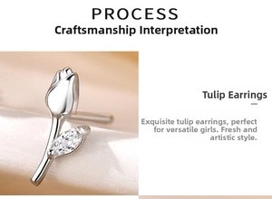 Detail of silver tulip earrings with marquise-cut zircon stones and polished finish