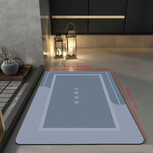 Absorbent diatom mud bath mat with HOME text in light blue, non-slip 50x80cm size