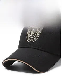 Detail of embroidered Freedom patch and curved brim with beige piping on a baseball cap