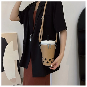 Unique milk tea cup shaped crossbody bag featuring straw detail and adjustable shoulder strap