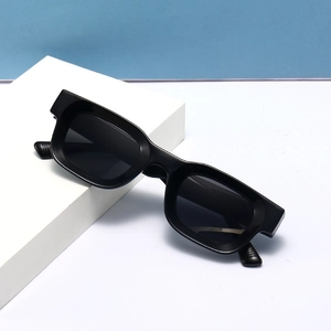 Minimalist black rectangular sunglasses with wide temples on a light blue background