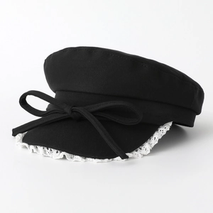 Classic black newsboy cap with elegant bow decoration and white lace trim detail