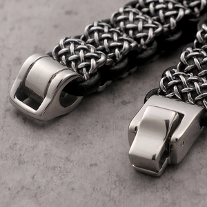 Men's braided leather bracelet with stainless steel mechanical clasp and vintage woven texture