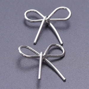 Macro shot of two silver 304 stainless steel bow charms for DIY jewelry making