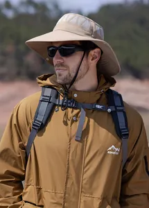 Detail of beige outdoor sun hat with breathable mesh vents and adjustable chin strap