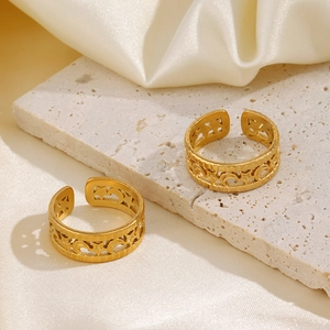 18K gold plated V-shaped ring featuring hollow moon and star patterns on white silk