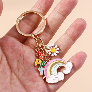 Golden keychain with HAPPY letter charms, daisy flower and rainbow for handbags
