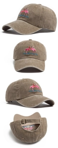 Close-up of pink flamingo embroidery and adjustable metal buckle on washed cotton cap