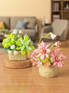 Detailed view of artificial block flower arrangements in beige woven basket pots