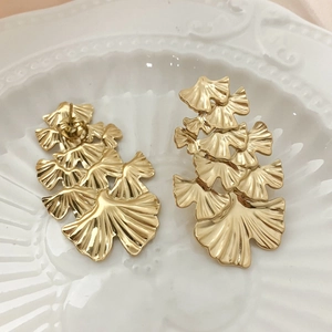 Elegant gold-plated ginkgo leaf stud earrings featuring a layered fan-shaped metal design