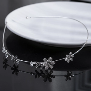Elegant silver flower headband with crystals and pearls for weddings and formal events